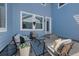 Charming outdoor patio area with comfortable seating and a patterned rug at 4821 Bluegate Dr, Highlands Ranch, CO 80130
