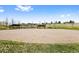 A community sand volleyball court with nets, surrounded by green grass at 4821 Bluegate Dr, Highlands Ranch, CO 80130