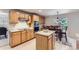 Charming kitchen featuring stainless steel appliances, breakfast nook, and bright countertops at 11803 E 114Th Pl, Commerce City, CO 80640