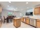 Bright kitchen with white countertops, wood cabinets, stainless steel appliances, and eat-in dining at 11803 E 114Th Pl, Commerce City, CO 80640