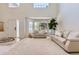 Spacious living room featuring high ceilings, large windows, and open entry way at 11803 E 114Th Pl, Commerce City, CO 80640
