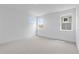 Neutral bedroom with large windows allowing natural light and plush carpet flooring at 223 Washington St, Erie, CO 80516