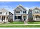 Charming blue two-story home with landscaped front yard and inviting entrance at 223 Washington St, Erie, CO 80516