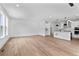 Open-concept living space with hardwood floors and modern recessed lighting at 223 Washington St, Erie, CO 80516