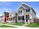 Street view showcases the charming blue home with well-maintained lawn and inviting curb appeal at 223 Washington St, Erie, CO 80516