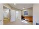 Basement office space featuring cabinets, drawers, and a countertop workspace under a window at 7734 Terry Ct, Arvada, CO 80007