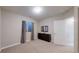 Neutral bedroom with a dark dresser beneath the window, featuring blackout curtains for privacy at 7734 Terry Ct, Arvada, CO 80007