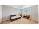 Bedroom featuring a daybed with throw pillows and window with blinds at 7734 Terry Ct, Arvada, CO 80007