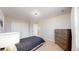 Bedroom featuring a bed with dark bedding, a dresser and a wall of closets at 7734 Terry Ct, Arvada, CO 80007