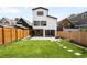 Expansive backyard with lush lawn, modern design elements, and privacy fencing, ideal for outdoor enjoyment at 4131 Osage St, Denver, CO 80211