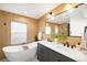 Stylish bathroom featuring a soaking tub and a dual sink vanity at 4131 Osage St, Denver, CO 80211