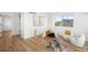 Bright bedroom with hardwood floors, stylish decor, and plenty of natural light from the large window at 4131 Osage St, Denver, CO 80211