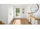 Bright entryway featuring hardwood floors, stylish decor, and ample natural light at 4131 Osage St, Denver, CO 80211