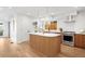Modern kitchen features stainless steel appliances, center island and view to the backyard at 4131 Osage St, Denver, CO 80211