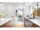 Bright eat-in kitchen featuring white countertop and sink with backyard view at 4131 Osage St, Denver, CO 80211