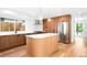 Modern kitchen features sleek wood cabinets, stainless steel appliances, and a stylish central island at 4131 Osage St, Denver, CO 80211