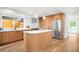 Modern kitchen with custom wood cabinets, stainless steel appliances, and spacious center island at 4131 Osage St, Denver, CO 80211
