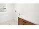 Clean laundry room with white countertop and wood cabinets at 4131 Osage St, Denver, CO 80211