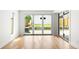 Bright room features hardwood floors, white walls and large sliding doors to the outdoors at 4131 Osage St, Denver, CO 80211