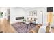 Bright living room with a modern fireplace, stylish decor, and a cozy seating area at 4131 Osage St, Denver, CO 80211