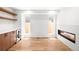 Bright living room boasts hardwood floors, built-in shelving, a wine fridge, and a modern fireplace at 4131 Osage St, Denver, CO 80211