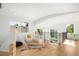 Bright loft area with light hardwood floors, large windows, and a decorative teepee and bearskin rug at 4131 Osage St, Denver, CO 80211