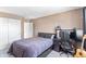 Cozy bedroom with a sleek bed, workspace, and ample closet space for storage at 209 W Jamison Cir # 32, Littleton, CO 80120