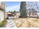 Charming front yard with a well-manicured lawn, mature trees, and a covered outdoor structure at 209 W Jamison Cir # 32, Littleton, CO 80120