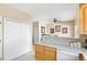 Functional kitchen space with ample counter space and storage near a pantry and dining area at 209 W Jamison Cir # 32, Littleton, CO 80120