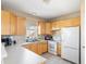 Well-lit kitchen with ample countertop space and light wood cabinetry at 209 W Jamison Cir # 32, Littleton, CO 80120