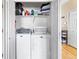 Functional laundry room with washer, dryer, and built-in shelves for organized storage at 209 W Jamison Cir # 32, Littleton, CO 80120