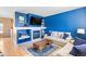 Comfortable living room with modern fireplace, entertainment center, and cozy seating perfect for relaxing and entertaining at 209 W Jamison Cir # 32, Littleton, CO 80120