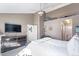 Spacious main bedroom with a dresser, ensuite bathroom, and comfortable furnishings at 209 W Jamison Cir # 32, Littleton, CO 80120