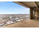 Overlook the neighborhood from this balcony with city views and concrete base adorned with a stone heart at 955 Eudora St # 1106, Denver, CO 80220