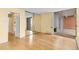 Bright bedroom with sliding glass doors leading to a balcony, wood floors, and mirrored closet at 955 Eudora St # 1106, Denver, CO 80220