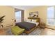 Cozy bedroom with bright walls, wood floors, balcony access, and chic decor for a relaxing retreat at 955 Eudora St # 1106, Denver, CO 80220