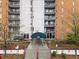 Attractive condo building featuring balconies and a covered entrance for residents and guests at 955 Eudora St # 1106, Denver, CO 80220