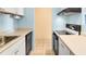 Clean kitchen features streamlined appliances and ample countertop space at 955 Eudora St # 1106, Denver, CO 80220
