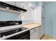 This functional kitchen is equipped with essential appliances and practical storage solutions at 955 Eudora St # 1106, Denver, CO 80220