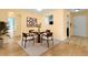 A dining table graces the living space, complemented by elegant hardwood floors at 955 Eudora St # 1106, Denver, CO 80220