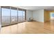 Sun-drenched living area with wood floors, floor-to-ceiling windows, and access to a private balcony, perfect for entertaining at 955 Eudora St # 1106, Denver, CO 80220