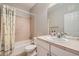 Bathroom with a shower-tub combo with a vanity and a neutral color scheme at 22580 E Ontario Dr # 202, Aurora, CO 80016