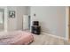 Cozy bedroom featuring light wood floors, a double door closet and modern decor at 22580 E Ontario Dr # 202, Aurora, CO 80016