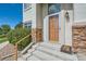 Exterior entrance to the home featuring the house number over the front door at 22580 E Ontario Dr # 202, Aurora, CO 80016