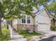 Beautiful home with stone accents and a well-manicured lawn at 6924 W Euclid Pl # A, Littleton, CO 80123