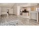 Spacious open floor plan with modern floors and an open kitchen concept at 6924 W Euclid Pl # A, Littleton, CO 80123