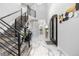 Inviting foyer with soaring ceilings, modern staircase, and stylish accents sets a sophisticated tone at 942 S County Road 129 Rd, Bennett, CO 80102