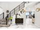 Grand foyer with modern staircase, stylish console table, and elegant decor creates a welcoming entrance at 942 S County Road 129 Rd, Bennett, CO 80102
