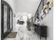 The grand foyer features high ceilings, elegant decor, and a modern staircase, creating a lasting impression at 942 S County Road 129 Rd, Bennett, CO 80102