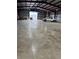 This wide open warehouse space has concrete floors and a truck in it at 942 S County Road 129 Rd, Bennett, CO 80102